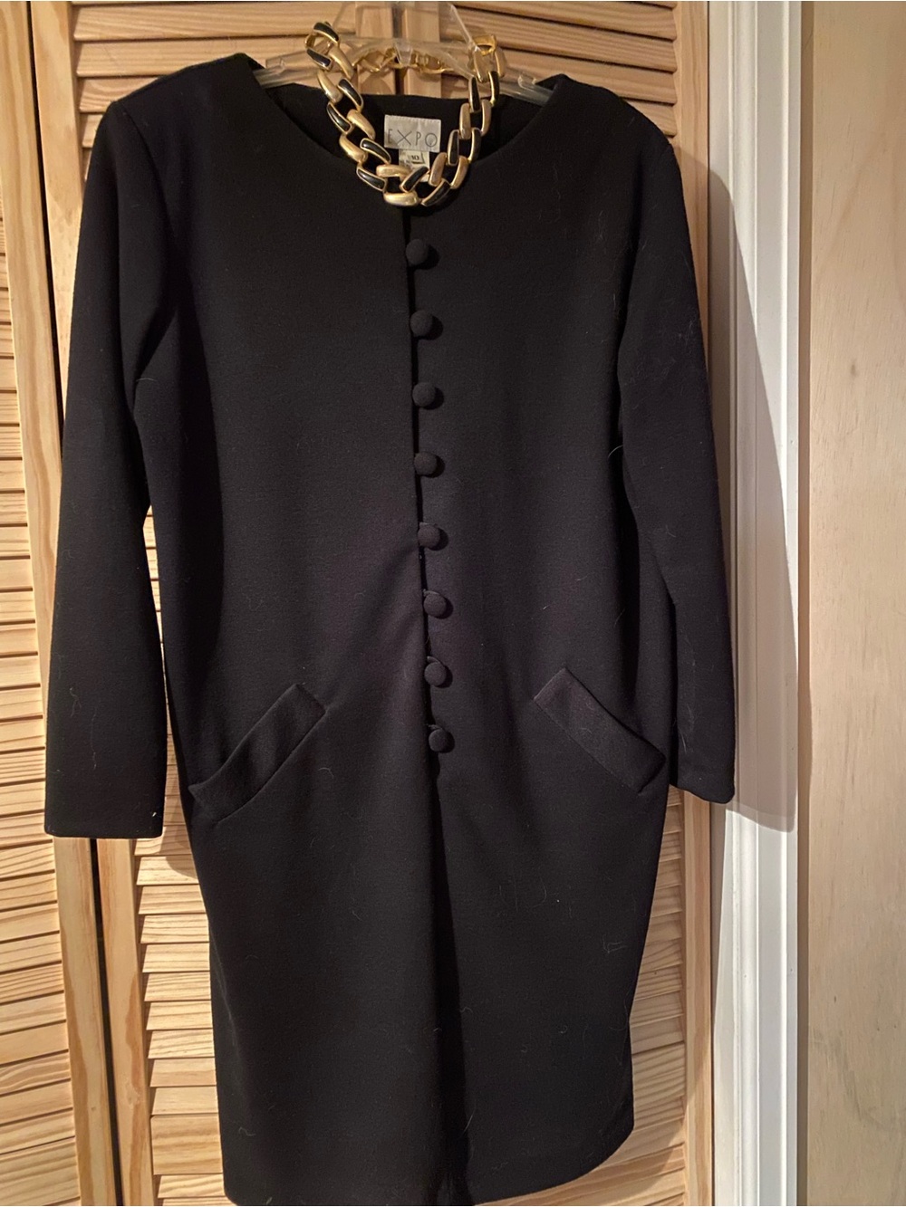 Elegant Black Long-Sleeve Dress with Covered Buttons and Matching Necklace